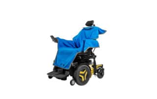Electric wheelchair with a blue waterproof towel over the seating area of the wheelchair